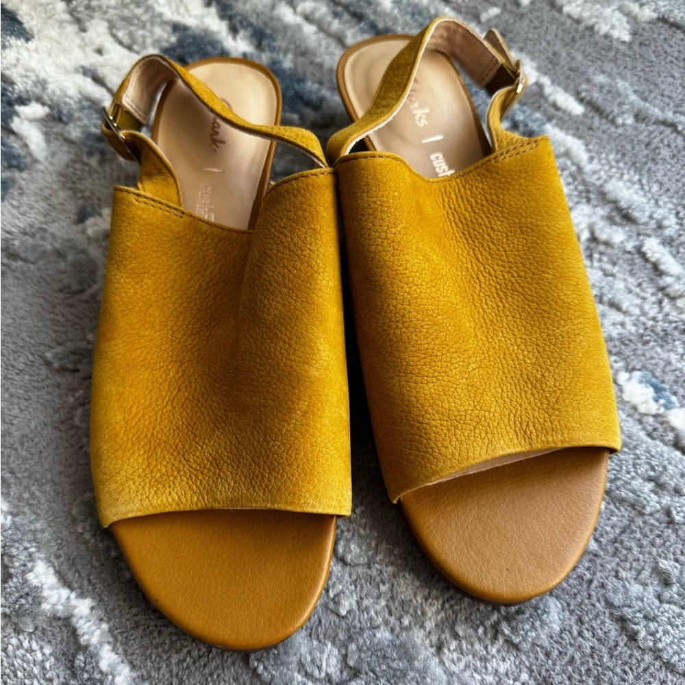 Clark’s sandals.